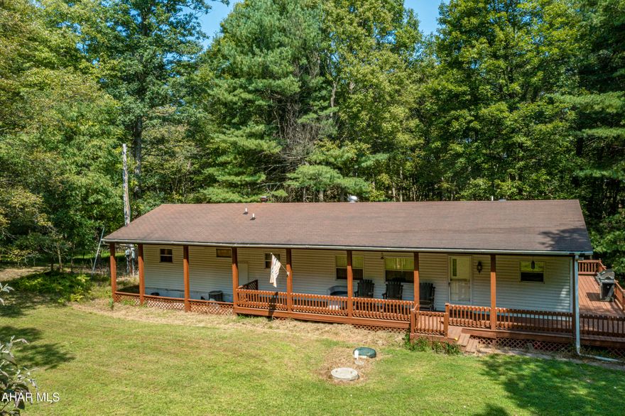 Welcome to your new home or vacation spot in Huntingdon County! It's nestled on 1.59 acres and is only 10 minutes from Lake Raystown Resort, Tatman Run and Trough Creek State Park. This home features 2 bedrooms, a full bath and a half bath located in the master bedroom. The large kitchen is open to the living room. Laundry is located by the full bath . Step outside to the large wood wrap around deck and enjoy the peaceful environment, only steps away from Rothrock State Game Lands. Schedule your tour today.'