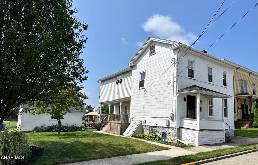 1900 Circa 2 story home with many renovations throughout!!!  Located in our lovely Historic Downtown Bedford. The second floor has been completely renovated with a newer bath, 2nd FL laundry and master bedroom with a large walk-in closet. New staircase and railing and the open foyer is complete with a powder room. Spacious living room with  fireplace, large, spacious dining room with a built-in china cabinet and a roomy  galley kitchen with pantry. Step out onto the back porch then to the 2 car garage which offers plenty of room for 2 cars.  New back patio,  overlooking the large back yard for your enjoyment.  Basement provides extra storage!