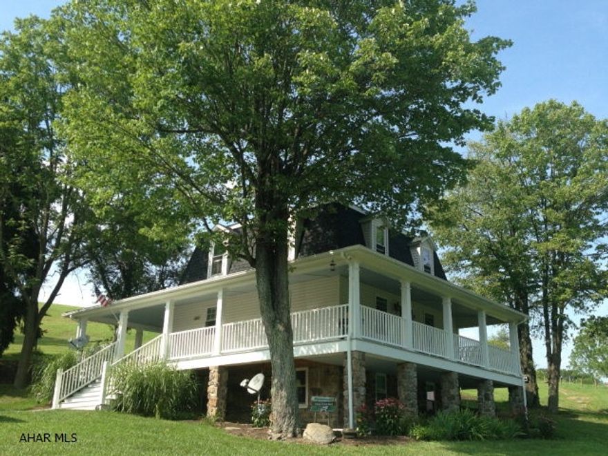 A touch of southern plantation nestled in the foothills of the Alleghany Mountains. Completely renovated old farm home on 22 private acres, where no detail has been overlooked. Everything in this home has been replaced including roof, plumbing, heat pump, electric, floors, walls, kitchen, 3 bathrooms, exterior siding, windows and doors. Recessed lighting, both inside and out, solid surface countertops in all 3 bathrooms, gorgeous wood floors and ceramic tile add to its upscale appearance. A beautiful lower level 640 sq.ft. guest suite with private entrance completes the home. Add the amazing barn and huge pole building and the possibilities are endless.
