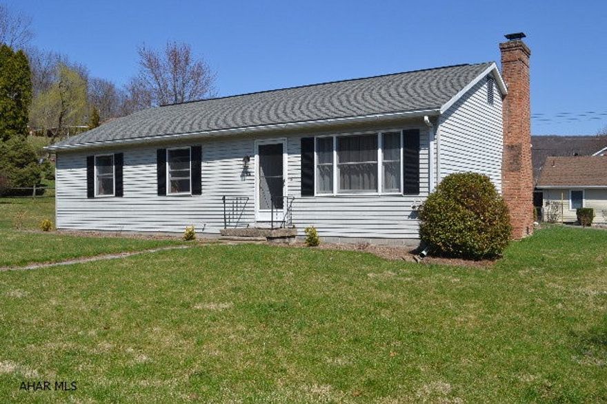 Single-story Showstopper!  The current seller has worked to make this the perfect move-in ready 3 BR, 1 BA in the area.  It includes: an open concept kitchen/dining room that has a cozy (& functioning!) wood-burning fireplace, a tastefully done living room also open off this space, 3 BRs (1 w/additional shelving in the closet & 2 w/double closets), a completely updated & modern bath, 1st floor laundry, & a convenient attached garage.  As if that isn't enough, the heat pump & central air were just put in in later 2012, it has a 200 amp breaker panel, *BRAND NEW* laminate flooring throughout & new carpeting in BRs.  The seller started to landscape, w/plenty of room left to add your own touch as well.  Sits on a great sized corner lot(100 x 120), w/a flat yard.  You could move right in TODAY!