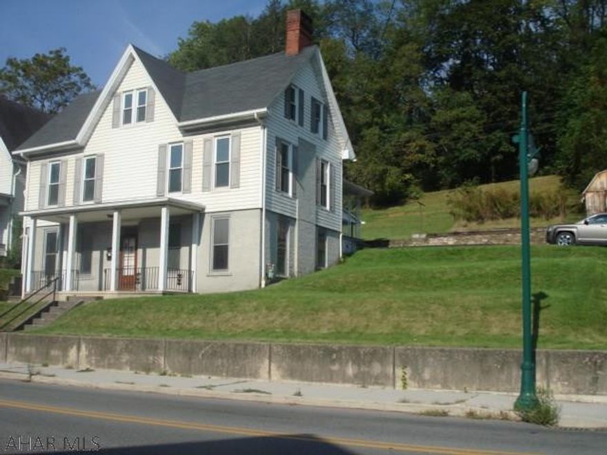 Experience the wonderful charm and character of this lovely home.  The rooms are very spacious with 8 and a 1/2 foot ceilings.  The large windows allow for lots of natural light, making this home very bright and cheery. The professionally painted interior adds to the welcoming appeal of this beautiful home.  The 3rd floor offers lots of storage or could be finished for more living space.  A laundry room and bathroom are located on the main level.  The kitchen has a large pantry for convenient storage.  There are some very nice built-ins throughout the home.  A carport and macadam parking area at the back of the house offers GREAT off-street parking, (A VERY UNIQUE FEATURE ON WASHINGTON AVE).  The large corner lot/yard, allows for outside enjoyment.  A Great Place to Call HOME!