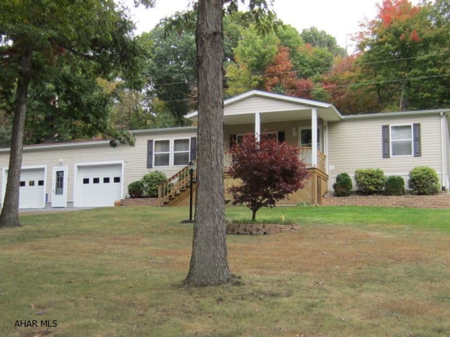 Looking for a quiet setting, check out this beautiful Champion double wide home situated between Johnstown and Bedford.  It has a wonderful open kitchen, dining, living room plan with plenty of space.  There are 2 bedrooms separated from the living area.  The master bedroom has plenty of closet space and a large bath with shower,  garden tub and skylight.  The two car garage is huge with a work bench and storage.  The 2 acres are ready for outdoor activities.  This is a very well maintained home.