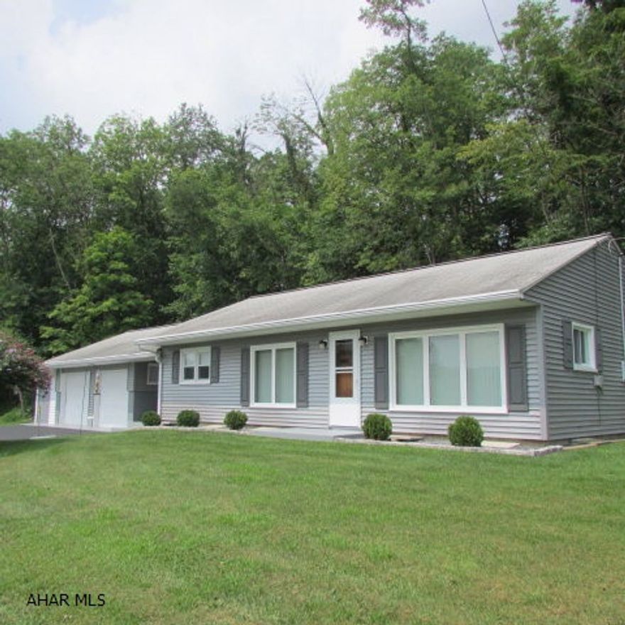 Well-maintained ranch on 1.90 acres in Hesston area. 10 minutes to Seven Points. Easy one-floor living. Lots of new - roof, vents and gutters, electric service, furnace and oil tanks, central air, siding, living & dining windows, ceiling fans, storm doors, energy recovery ventilator, kitchen range, etc. Inside needs some updating but has nice layout. Has 2 bedrooms plus a bonus room with a separate entrance from the covered porch area; currently used as an office or can be bedroom. Two-car garage has 8x22 storage area attached.  Plus a 16x12 shed. Garage has storage above and workshop area. Nice seasonal views. Paved driveway.  On crawlspace; no basement. Great as a residence or seasonal home!