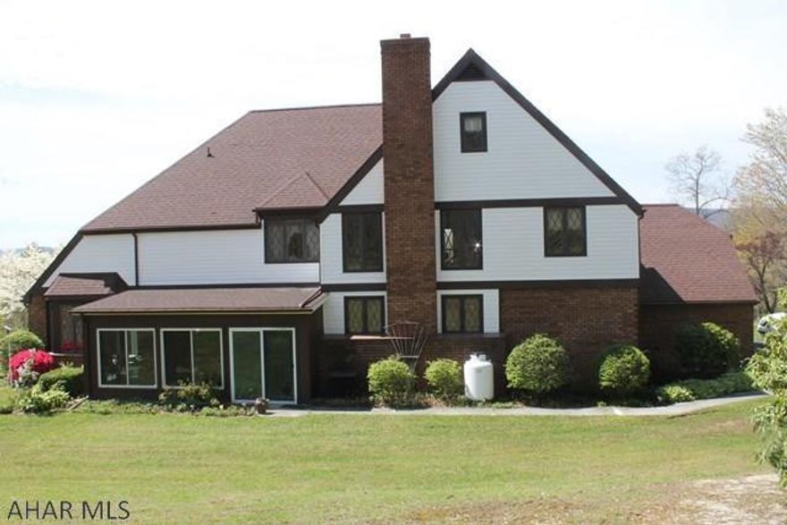 Beautiful 2 1/2 story 5 bedroom and 3 bath home. English Tudor style with easy care exterior. Nestled on 5 acers with immaculate kitchen including granite and stainless steel. Cherry and bamboo floors throughout the home with a second floor loft to be used as a bedroom or entertainment room. Additional bonus room on the third floor, this home is unbelievable. Close to ski resort and major highway to shopping and entertainment. Please call for a private showing.