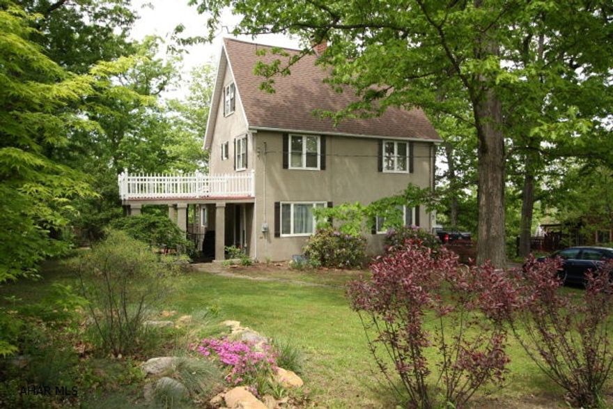 Absolutely beautiful, well-maintained property located in the peaceful surroundings of Beverly Hills! The seller spared no expense to make this property fantastic.  Just minutes from Penn State Altoona, this home features a finished basement with wet bar, 2 magnificent gas fireplaces and hardwood, marble and porcelain flooring throughout.  The kitchen includes a fantastic breakfast nook and porcelain tile, while the bathrooms have been recently updated with custom walnut cabinetry and marble flooring.  The bedrooms are spacious, and include plenty of closet space. After a long day, relax on the beautiful, covered, recently updated courtyard with family and friends. The mechanics are sound, and the electrical, plumbing and roof have all been updated. This property is move in ready!