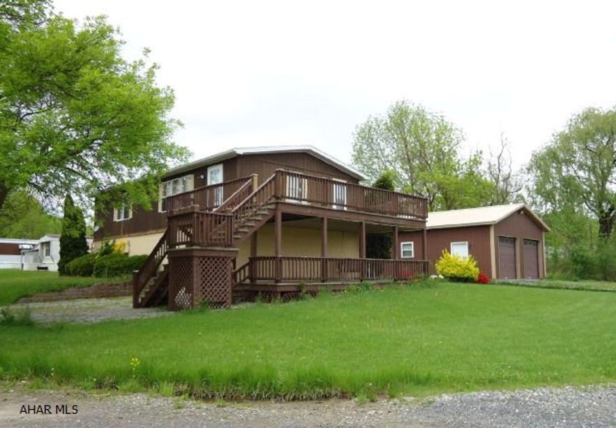 Large lower level family room and half bath, 1 car integral and 2 car detached garage. 2 level decks. Take a look.  Lot size 88 x 119 x 68 x 115.