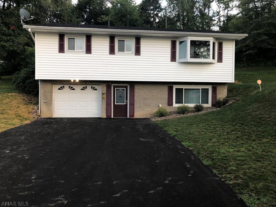 You are going to want to check out this meticulously maintained home. If you want to move right in, well this is for you. 3 bedrooms, 1.5 baths, ceramic tile and hardwood floors. The lower level has an updated family room with newer carpet and recessed lights, a half bath and laundry room. Enjoy sitting on the covered rear patio with new carpet. Freshly paved driveway, updated landscaping. This is within walking distance to Penn State Altoona Campus and also has a 1 car integral garage. Central AC, Trane Furnace, newer roof are a few of the great features of the home.