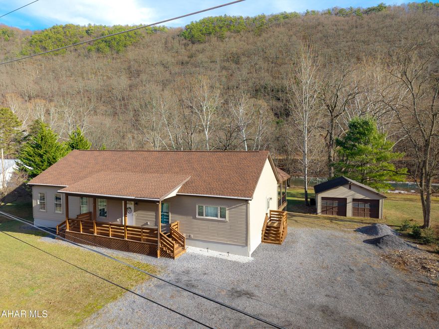 Wake up to the river and unwind by the water! This 3-bedroom, 2-full-bath home delivers the lifestyle people daydream about. Set along the river and just minutes from Raystown Lake, it delivers everyday comfort with instant access to outdoor recreation.

Inside, natural light pours through the home, giving every room an open, easy feel. The layout is practical and welcoming, whether you're hosting friends, working from home, or just enjoying the view with your morning coffee.

Out back, a newly added deck extends the living space and makes the most of the river setting, making it perfect for grilling, relaxing, or watching the water roll by. The house is NOT located in a flood zone, offering peace of mind without sacrificing waterfront living. A detached 2-car garage provides plenty of room for vehicles, toys, and lake gear.

If you're looking for peaceful riverfront living with quick access to Raystown recreation, this one checks those boxes, and then some.
