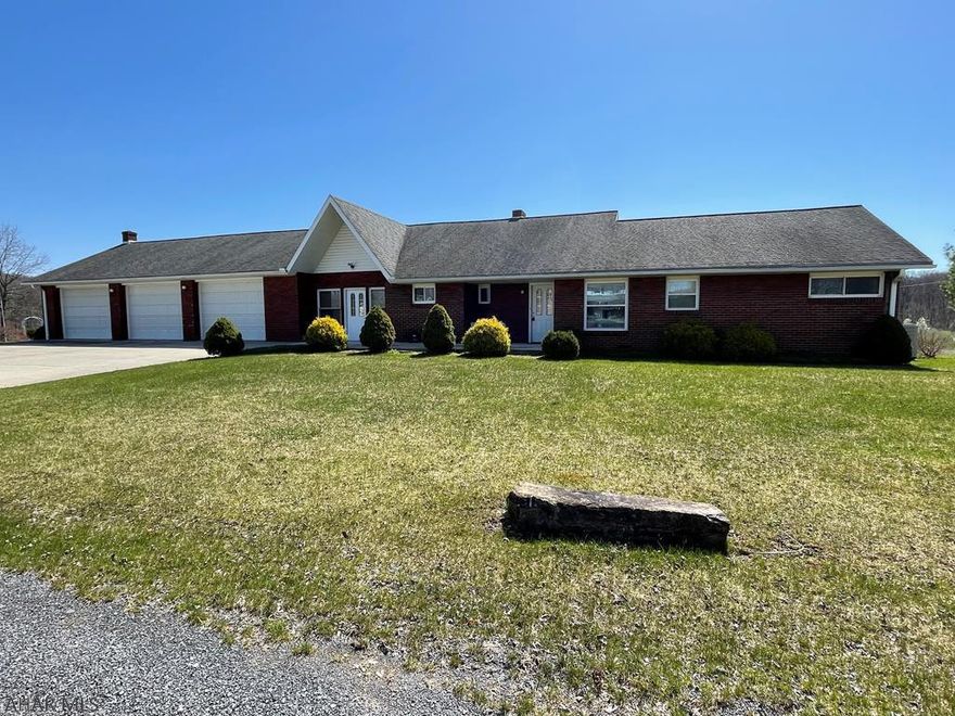 Check out the Virtual Tour!  Within a 5 minute drive from Downtown Bedford, this spacious 4 bedroom, 3 full bath brick home is equipped with a 3 car garage, as well as a full lower level oversized garage. The main level includes a wood fireplace in the living room, one full bathroom with a wheelchair accessible shower, 3 bedrooms, a large living room, and an office. The lower level has plenty of storage, a bedroom, 2 bathrooms, laundry area, a kitchenette, and a spacious living area with garage and outside access. Come see this property! *Comes with HSA HOME WARRANTY.