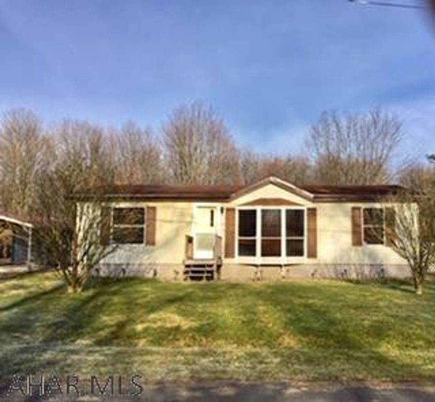 Well-maintained manufactured home on 0.27 acres. One owner. Carport and shed. All new carpet and newly painted cabinets. Nice, flat lot that is full of potential.