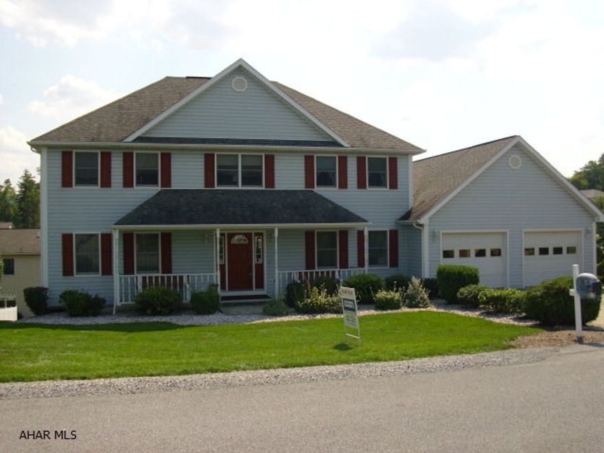 Three finished floors.  Much larger then appears from street.  4 BR, 3 1/2 BA, 2 family rooms.  Large deck and patio with hot tub. 24x48 four car garage with full loft.  Hickory eat in kitchen.  On a cul de sac.  Holiday Heights.  Large 14x42 deck.  Jacuzzi Tub.  Home protection plan and security system.