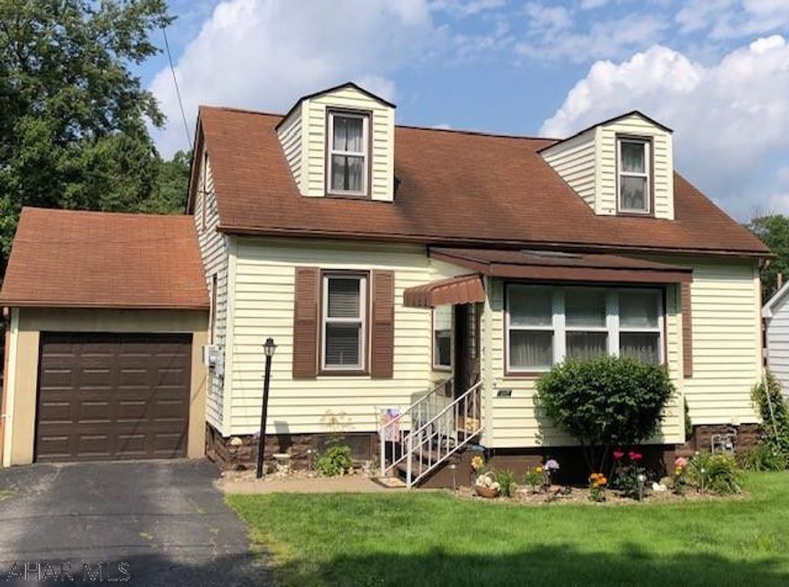 Step inside this immaculate three bedroom home. This home has a  bedroom and bath on the main floor. Enclosed front porch makes a great mudroom or sitting area. Enjoy the outdoors on the nice deck. This home is situated on a nice flat lot! Large full unfinished basement is great for storage. This home is a must see and is priced just right.