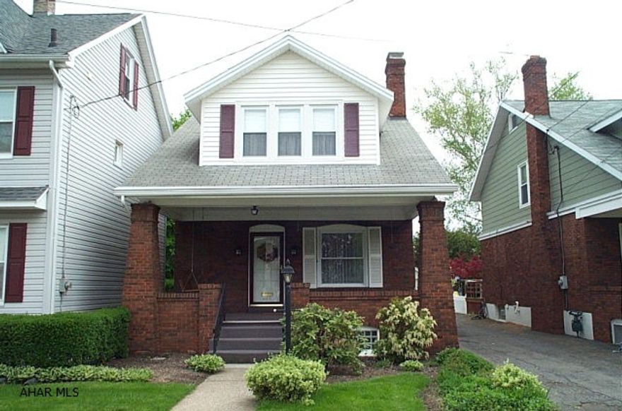 Brick 3 BR minutes away from Baker Elementary School. Front and rear covered porches. Shared driveway and garage.