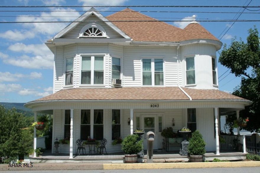 This immaculate Victorian style home will take your breath away as soon as you step inside. The kitchen features custom cabinets that add to the character of the home. The large living areas have windows all around providing full, natural light and pleasant evening breezes. The basement has a finished living room, bathroom, dining area and a restored bar for all your entertaining needs. A custom built greenhouse and a full garden in the back yard are a gardeners dream. Nice setting and over 1/2 acre lot. 2-car detached garage.
