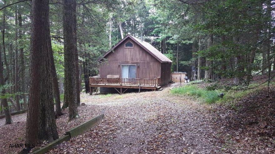 1 and half story cabin on two lots inside Glendale Yearound. 2 bed and 1 bath in this small cabin make it perfect for weekend getaways or even a permanent residence. Back porch has been closed in and made into a type of Florida room with lots of windows. Small shed is in the rear. Glendale Yearound is a gated community located minutes away from Glendale Lake, Prince Gallitzin State Park, and Rock Run ATV Park. Community pool, basketball, tennis, security, etc.