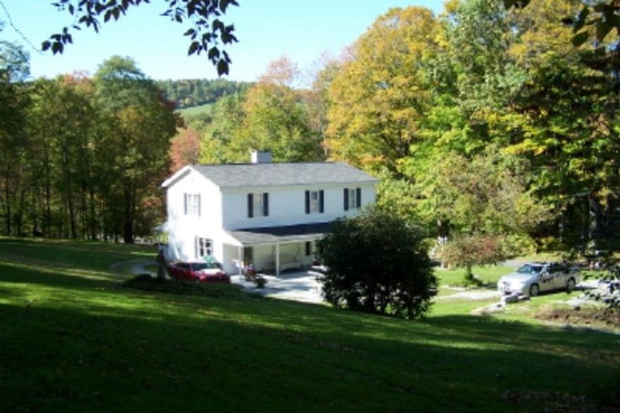 Sweet property on 5+ acres in quiet, private area of Hastings.  Large spacious rooms throughout.  New kitchen.  New 1st floor bath and laundry.  Two very large bedrooms and bath on 2nd floor.  Either bedroom could be converted into a 2 bedroom space.  Entire interior of the home has been recently redone.    Newer drywall and insulation.  Furnace in 2007.  All new vinyl tilt thermo windows.  Closet space galore.   Amazing wrap around porch.  Patio.  Circular driveway.  Exceptional setting for this lovely home.  Sewer septic system is wildcat system which is common to this area. Seller has an estimate on file to install a new septic system. With an acceptable offer Seller will have the new system installed as per the estimate.