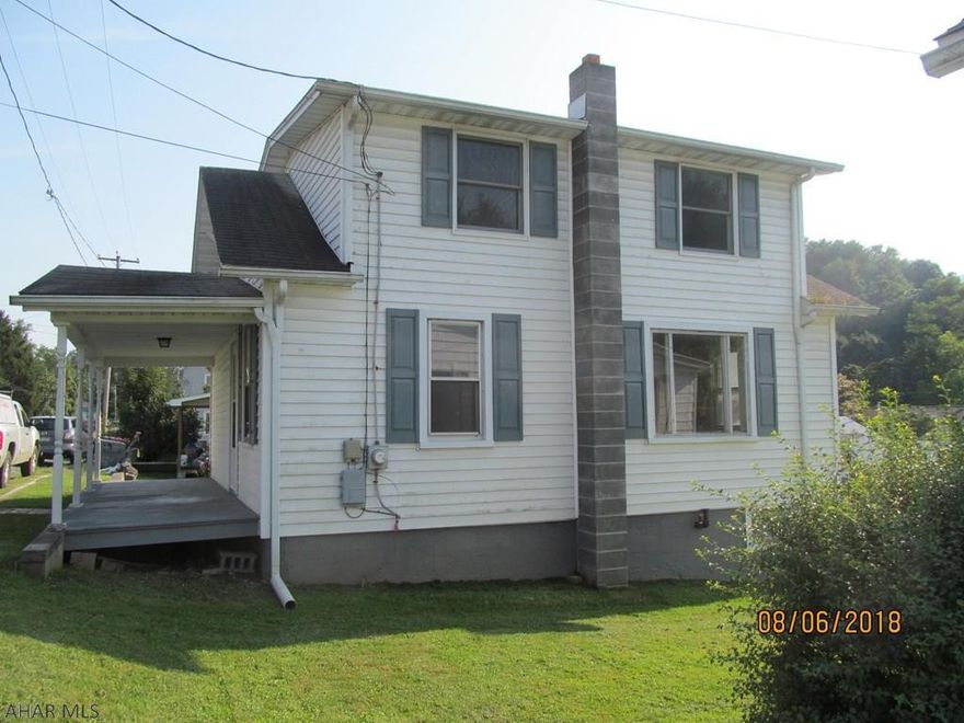 In town, but on a quiet street, this 2 sty home has the advantage of being close to all amenities, but away from noise & traffic. The kitchen is eat-in and there are hardwood floors downstairs. 3 bdrms & walk-in closet upstairs. Full baths on both floors.   Wonderful, level backyard w/ loads of potential. Plenty of room to put a garage, garden, grilling area & still room for the kids to play!