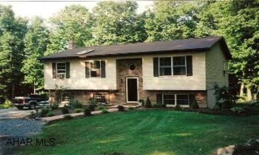 Charming 4BR/2BA Raised Ranch w/circular drive on 1.77 acre lot in private woodland setting. The home includes a large eat-in kitchen, living room, large family room, laundry room & extra large rec. room. The property also offers large deck, patio, shed Contingency: there is an individual with the right to purchase until 9/30/2006.