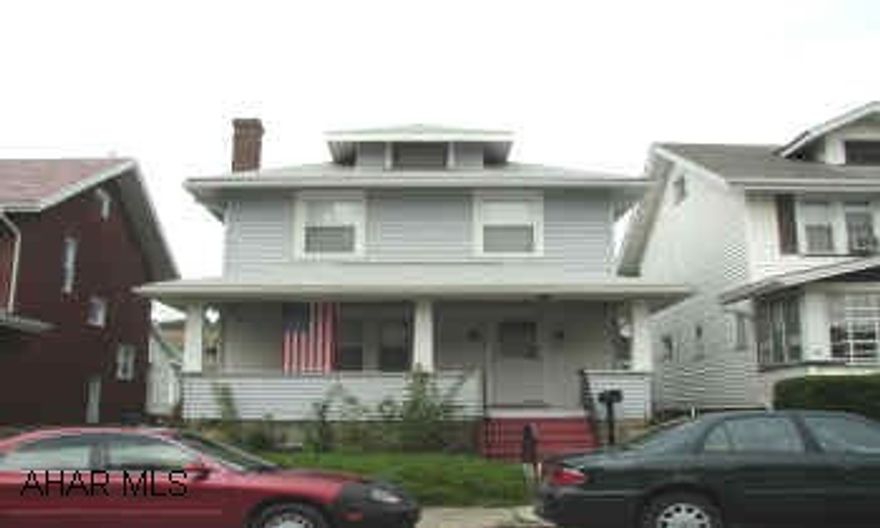 VINYL SIDED 2.5 STORY WITH NEW WINDOWS, LARGE ROOMS, 2 CAR GARAGE ON 35X120 LOT.