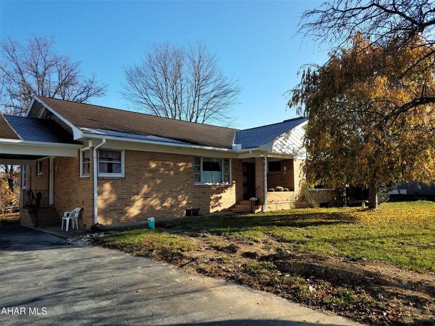 Location, location, location! Situated in the desirable Meadowbrook Terrace neighborhood, this brick ranch home has plenty to be desired.  Over 1700 sf of living space on the main level provides ample space and easy one floor living.  The kitchen features ceramic tile counters and back splash.  You can enjoy your morning coffee at the breakfast bar or use the adjacent dining room.  The spacious living room features a propane fireplace with a brick hearth.  The bedrooms are spacious; they will hold a California king-sized bed and have plenty of room left over.  All of the closets in the house are cedar lined.  The linen closet even contains a laundry shoot to the laundry room in the basement. The windows have marble sills.  The walk up attic affords plenty of storage space and head space.  The basement is partially finished, containing an office with a 3/4 bathroom.  The laundry room is ready for your finishing touches.  The unfinished recreation room contains a wood burning fireplace.  The one-car integral garage is deep enough to park your vehicle and have room for a lawn tractor or other equipment.  If you have too much stuff, the storage building with a new roof gives you more storage options.  The 1/2 acre lot allows for outdoor activities without having too much mowing to do. The property has public water and sewer with natural gas available at the street. Come take a look, your forever home may just be this one!