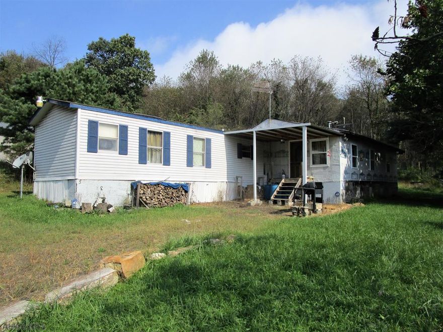 This property contains a single-wide mobile home with an addition.  It offers 4-bedrooms, 2-baths, LR & Kitchen.  Newer detached 2-car garage with electric.  Wooded lot offering 5.37 acres.  Close to the Cumberland Damn with Lakes Coon & Gordon, State Forest Lands, Rocky Gap Resort and the PA/MD line. Would make a great get-a-way cabin for recreation!!