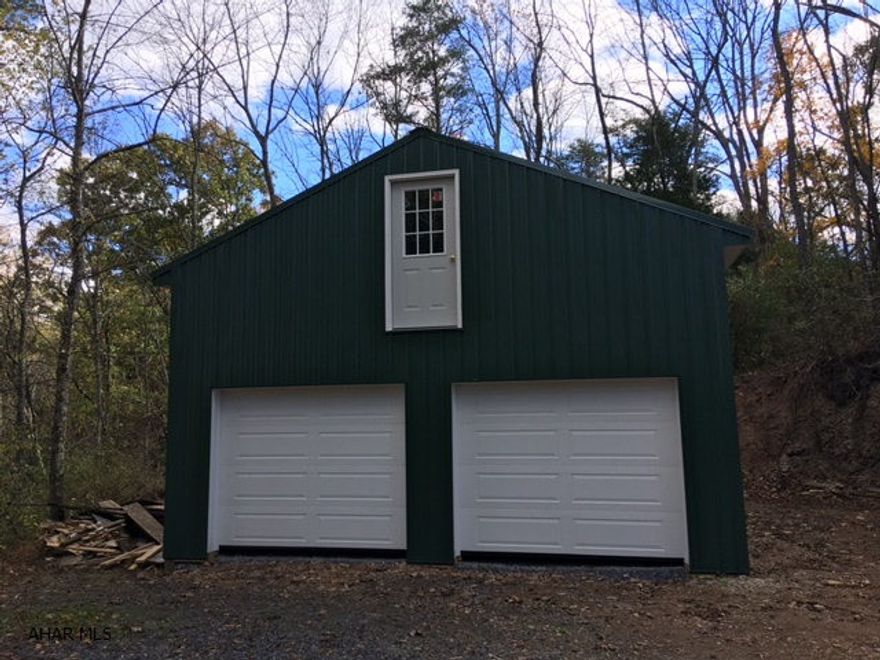 Over 6 acres in a private, rural setting with spectacular views of Sideling Hill. Sand mound in place. New 2 story garage. Unique tree stand with hunting opportunity. Building site has been excavated. Ready to go!