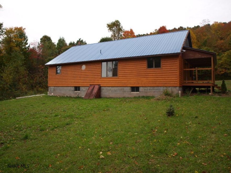 A well built 1979/1980 Log home on Shaffer Mountain. Quaint and Cozy 3 bedrooms 1 bath and a detached 2 car garage. Laminate flooring and carpet throughout. Approx. 10 acres of woods.  Basement could be finished for an additional family room and plumb for a 2nd bath. Solid detached 2 car garage needs TLC.  Great County Home!!