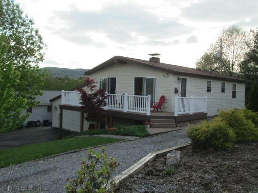 Immaculate three bedroom with two baths.  The large Master Bedroom Suite features two closets and 3/4 bath.  The open floor plan opens to the front deck with panoramic views.  The Harmon wood/coal stove makes utility bills very low.  The lower level is totally finished to included the third bedroom, family room, and beautiful wet bar.  Don't miss the rear patio and swimming pool!  This sale includes all furniture, electronics (flat screen TVs), floor coverings, window treatments and appliances with acceptable offer!