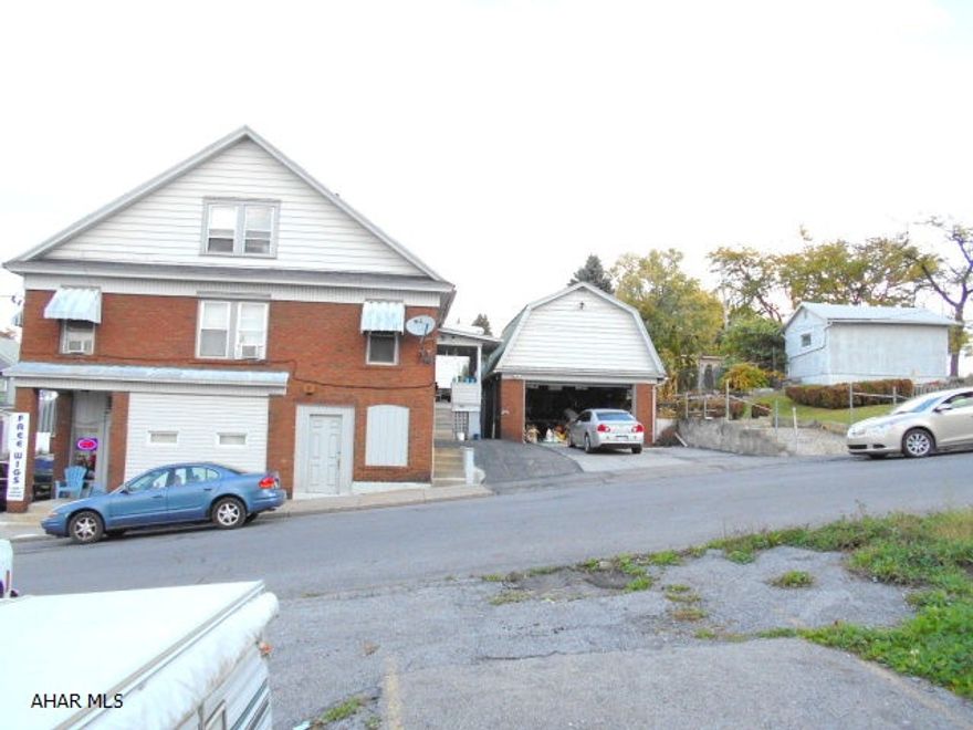 This is a great 3 unit commercial builing. First floor is a 1500sq ft store front. Two 3 bedroom apartments on the second floor. all utilities are paid by tenant except water and sewer, but there are 3 separate meters for the savvy landlord. All units are rented out and in great shape. The property Has a 1 car detached garage and off street parking for 4 cars. This is beside the park for the youngsters to play. If your looking for a solid investment this is worth a look at. Fha and conventional mortgages wont apply. This will take cash or a commercial loan to purchase.