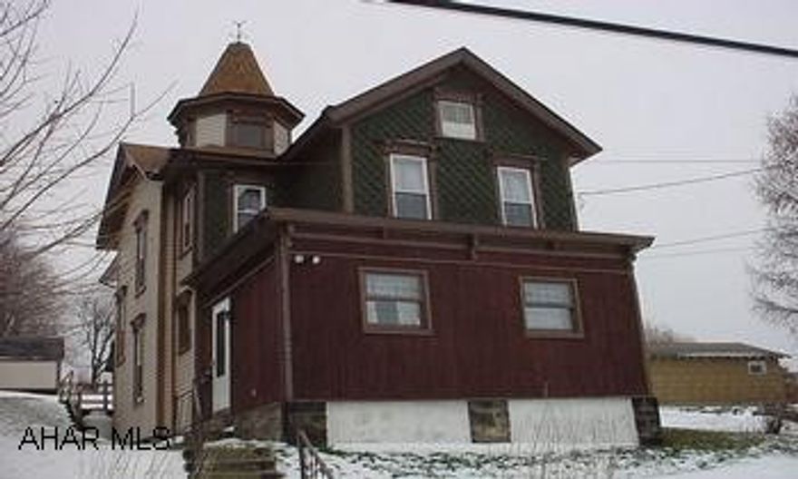 Victorian home with 4 bedrooms, 1 3/4 bath. Large eat-in kitchen with built in appliances, dining room, living room with fireplace. Large foyer arera with curved stairway. 1st floor laundry and bath. Mostly new windows and updated wiring.