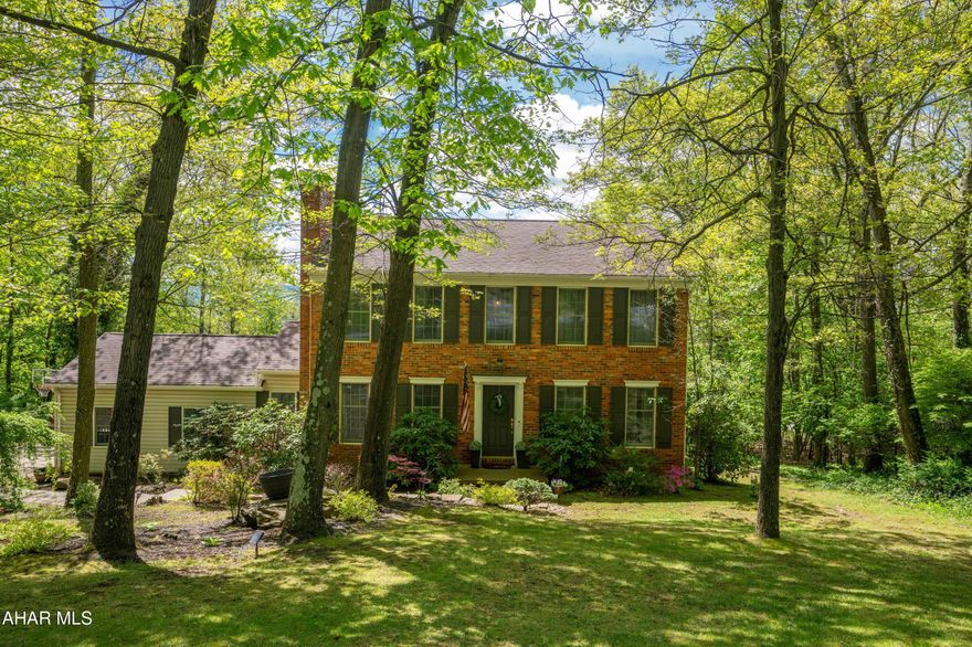 STONEHEDGE.  One of the original Stonehedge homes...quality thru-out.  Starting with the main level offering 2 fireplaces, Hardwood floors. Step down family room that walks out to the sunroom. Eat-in kitchen..windows everywhere allowing light to flow into the house...looking at fantastic views from all windows.  Three bedrooms and two baths on the 2nd level ..all hardwood floors. Primary bath has been updated, there is a Jack & Jill bath between the two bedrooms. The lower level has a bedroom, dressing room, full bath..plus large play area.  This room could be for mother, kids,  guests..offering privacy with own entrance.  Outside enjoy the fenced in yard with play area and fire pit. Convenient to schools, Y, Frankstown Elementary school. Don't miss this lovely home.