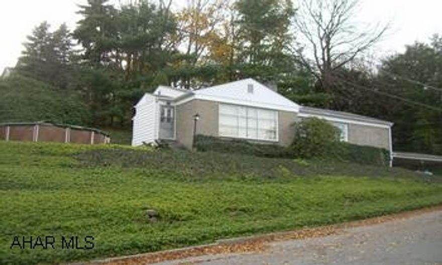 Seller will consider any reasonable offer. Brick & Vinyl Rancher Solid Brick & Vinyl rancher with many amendities.  Home has been in original family since built.  Living Room with gas Fireplace, finished basement with wood burner & wet bar, integral garage & carport, hardwood floors, nice lot at end of Avenue.