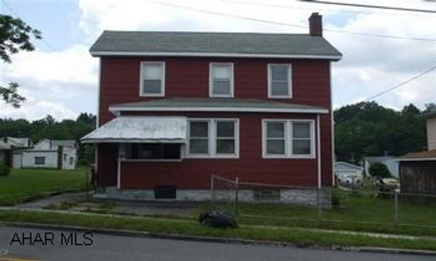 Composition siding.  2 furnaces  - oil & coal.  Coal bin and oil tank under enc. fr. porch.  Panels around patio are removable, as is back wall of carport. Electric shut off by owner - meter pulled.  Pipes winterized.  Property being sold "AS IS".
