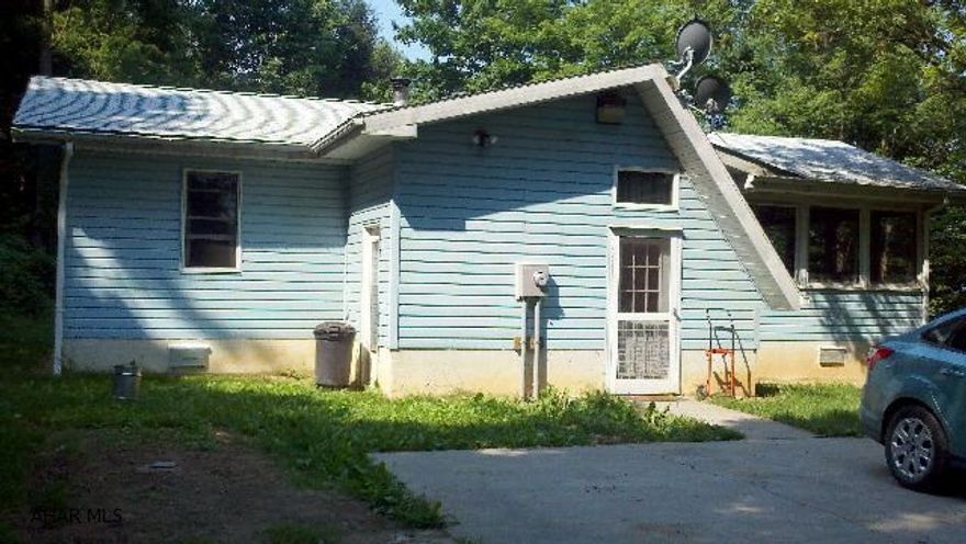 Country Cutie  -  cozy 2 bedroom, 1 story in move in condition, on 7 acres of wooded land that joins the State Game Lands.