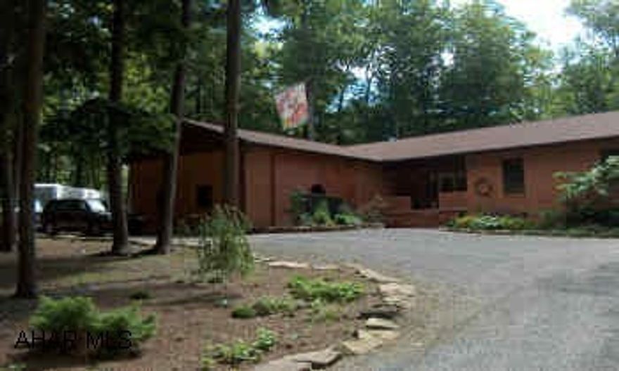 Stunning & Spacious brick ranch on 1.25 secluded acres. Lush landscaping w/ exterior lighting. Sunken Great room w/cathedral ceilings. Large MBR suite w/ walk-in closets, French doors in LR open to rear covered deck, gorgeous views from every  Stunning & Spacious brick ranch on 1.25 secluded acres. Lush landscaping w/ exterior lighting. Sunken Great room w/cathedral ceilings. Large MBR suite w/ walk-in closets, French doors in LR open to rear covered deck, gorgeous views from every window! Detached Cedar garage & 2 story cedar shed. 400- ft sweeping drive-thru w/ample RV parking. Newly remodeled, new roof, new 5-zoned oil hot water heating system. Culligan water purification. Central Vac. Community pool & numerous rec facilities. 1/2 mile to Glendale lake & state gamelands. A must see!