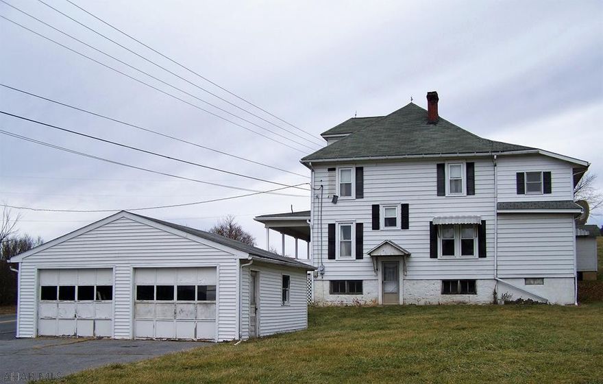 This is a charming two story old style country home on 8 acres. The first floor offers a spacious living room, dining room and a large eat in kitchen. There's plenty of room for entertaining or for family gatherings. There is also a 1/2 bath along with a pantry and laundry hook ups on the first floor. This home has 4 nice sized bedrooms on the second floor and a full bath. There is a deck off of an upstairs bedroom that needs finished. Outside this home offers a smokehouse, a root cellar and a summer kitchen. There is also a  two car detached garage with off street parking. There is attic storage. Plenty of room to plant a garden and enjoy the scenery!  This home has tons of potential!  It needs some updating.  Come and see this charming country home and make it YOUR home! Being sold AS IS