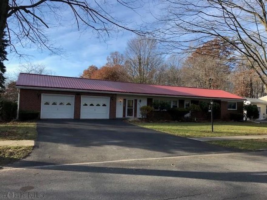 Stunning brick home with tons of updates.  Home located on a beautiful tree lined street.  Updated metal roof, new furnace, new windows, new doors and new deck.  Gorgeous sunroom.  Fenced in yard.  Furniture is negotiable. Structure is no longer in a flood zone.