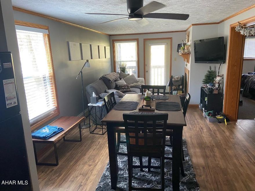 THIS  IS IT!  A FIRST FLOOR , CORNER condo at the very desirable Blue Knob Ski and Country Club!  Your perfect weekend and vacation getaway - or use as an investment.  New windows in 2022,  Digital wi-fi door locks and video doorbell.  New upgraded and HOA compliant wood burning fireplace installed in April 2021.  Appliances and cabinets in kitchen have been upgraded.  Pergo flooring throughout living spaces and baths.  Upgraded bathroom fixtures and shelves in wet bar area. Water heater new in October 2020.  On property hot tub, indoor pool, outdoor pool, tennis and pickle ball courts, access to hiking trails, coin operated laundry,  golf course and restaurant.