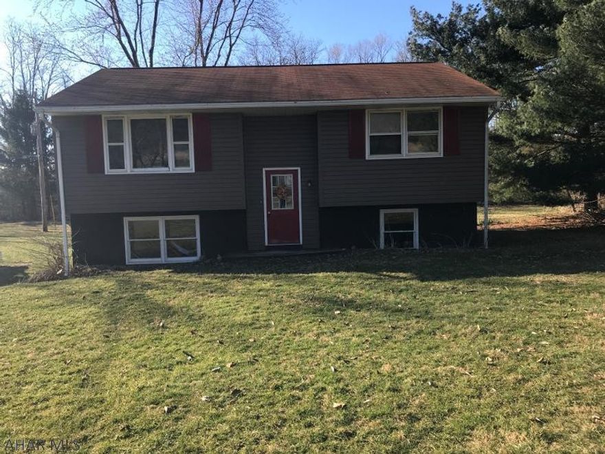 70's bi-level, 2 bedroom, 1 full bath in need of TLC. Enjoy the treed lot and stream. Sale AS-IS.