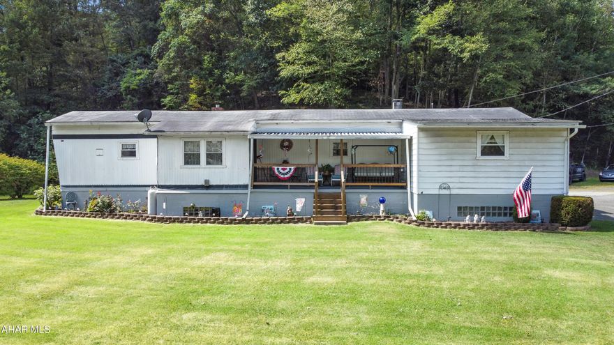 Experience the perfect blend of luxury, comfort, & acreage w/ this beautifully updated home set on approximately 13.6 private acres in the United School District. Resting on a full foundation, this manufactured home boasts a spacious main level w/ an inviting living room, a charming eat-in kitchen, three generously sized bedrooms, & a full bath, while the partially finished basement offers additional living space complete w/ a wood-burning fireplace, laundry, mechanical room, storage, & a half bath that is unfinished. Outdoor living is just as impressive, featuring a covered front porch, rear patio, a versatile carport that can be enclosed, a detached one-car garage, a two-car carport, & a heated workshop—all with power. Whether you're entertaining, relaxing, or simply enjoying the beauty of the land, this property provides endless opportunities to embrace refined country living. Call today to schedule your private tour!