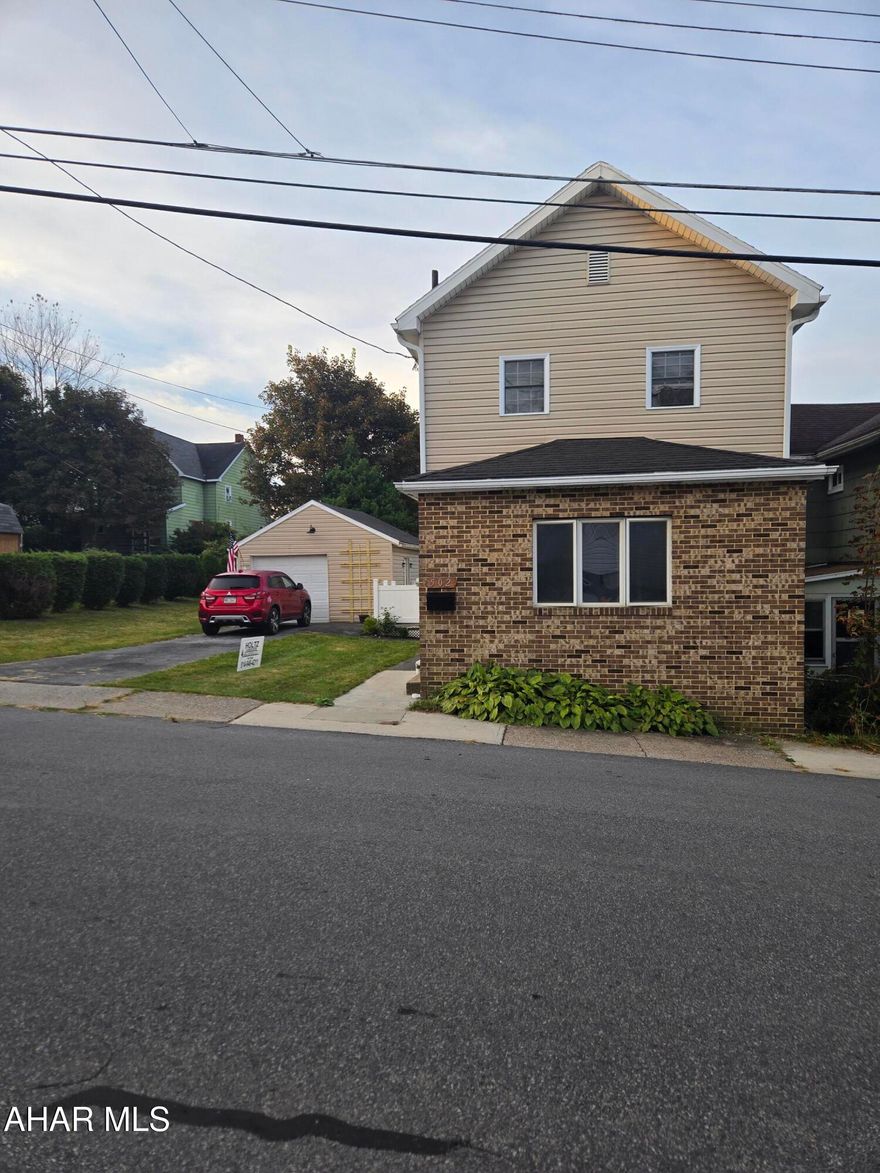 Nicely remodeled two story vinyl sided home with a detached garage and paved drive. This home features 3 bedrooms, 2 bathrooms, remodeled kitchen, living room and dining room. New floor coverings this home is move in ready!