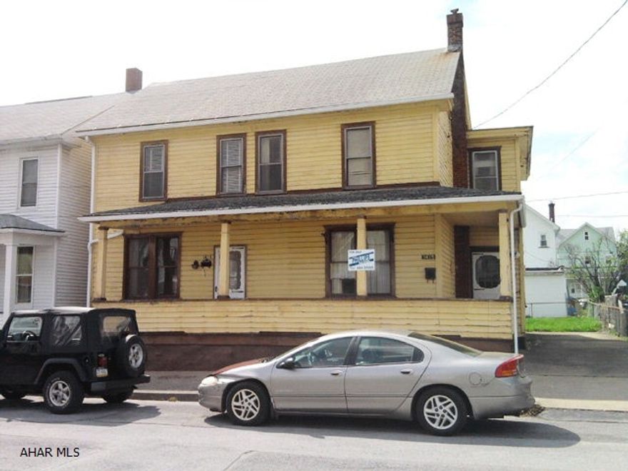 2 1/2 story, frame double house with 3 bedrooms each side. Off-street parking.