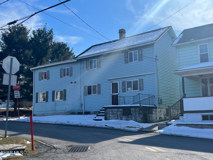 Vinyl sided two story in need of rehab. This home needs interior remodeling and mechanics. Being sold to settle estate. Rear porch in poor condition.
