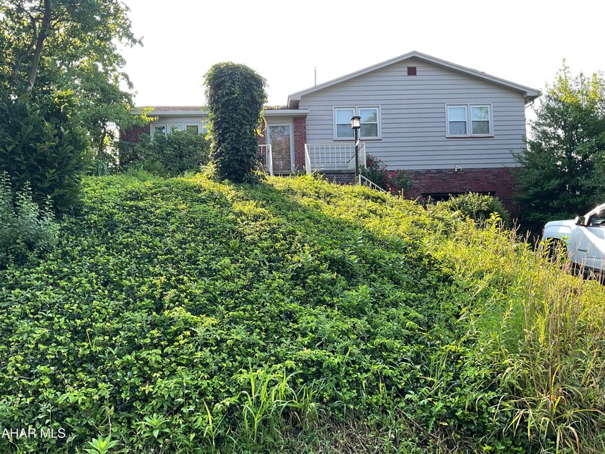 Here is your chance to live in the coveted Highland Park neighborhood. This 3 br split level is on 75x120' corner lot! Panoramic vista view of the valley from front porch. The back porch is covered for absolute privacy! Full bath upstairs and lower level! Plaster walls and many hardwood floors!  Large eat in kitchen! 1 car integrated garage with shed in rear!