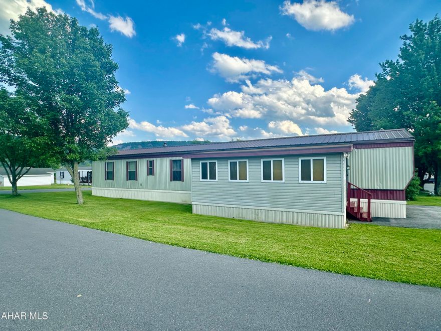 Pristine, Spacious & Immaculate are the words that describe this two bedroom, two bath single wide mobile home located in Greendown Acres Mobile Home  Park.  Laminate flooring throughout, updated kitchen & baths. Laundry  area.  Finished enclosed additional room could be a family room or storage area.  Cozy patio area and a shed for storage complete the outside. New metal roof in 2021. Sun was coming in the windows when photos were taken...new photos coming.
