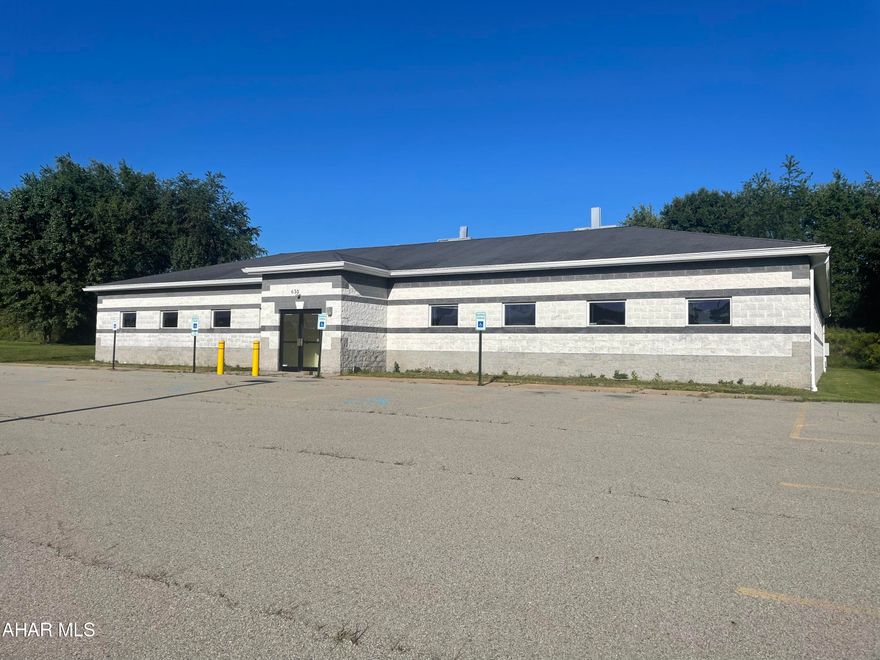 9680 sq ft building block building in Industrial area. Open space with 8 rooms on the outside of it. Kitchen with sitting. Mop Closet. Two restrooms. 3 phases electrical.  Central Air. Generator. Network capable. 2.88 acres with 98 parking spaces. Many possibilities.