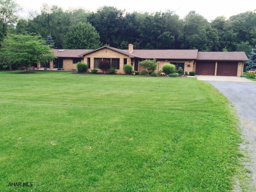 One of a kind custom built All Brick Ranch Home on 2.04 Private Acres. Just gorgeous!! Over 3000 square feet. The foyer is large with ceramic tile flooring a large coat closet. Large Custom kitchen...every cooks dream!! Corian countertops and ceramic flooring. Center island holds the cook top and new oven. Also you will find a 2nd new wall oven (Convection) and microwave. This home offers a Family room with doors to the Lanai...perfect for entertaining. The Great Room... three walls of windows!! So much natural light. Vaulted ceilings. Living Room has a cozy feel with beautiful Stone Fireplace. Master Bedroom has a Full Bath, Large Double Closet and a Walk In Closet. Step into the Indoor Pool area...WOW! Beautiful stamped Concrete Patio and Slate walkways. So much more....