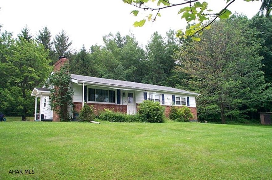 Sinking Valley rancher on 2.06 acres, plaster walls, hardwood floors under carpet. 3 Car garage, covered patio.