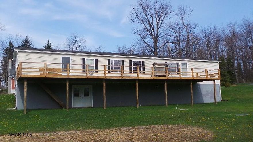 Spaciouss 16 x 80 mobile home on foundation. 30 x 50 garage with 3 doors, finished area and storage above, lot borders Altoona watershed and Blair County line. Exceptionally nice, 2 bedrooms, 2 bath home on 2.1 acres 12 x 50 deck, 2 x 6 exterior walls and other upgrades. Septic is a small flow treatment system.