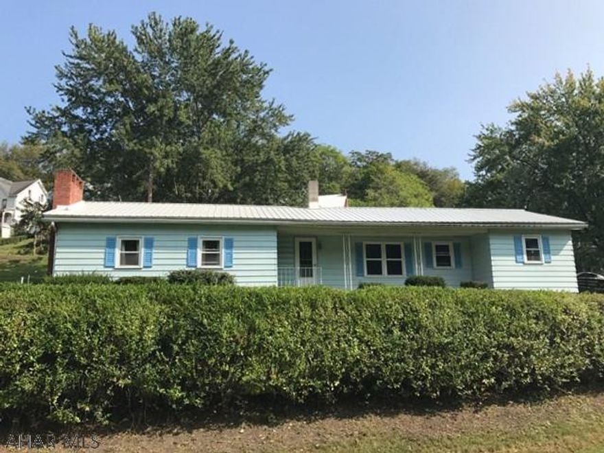 Spacious doublewide on foundation with lots of options. Awesome location with big yard. Two car garage next to house with additional outbuilding behind. Open kitchen, dining and living area with lots of natural light. Large laundry room. Covered porch/breezeway. Two bedrooms with built in closets, could be removed for more space. Large family room that could be converted into spacious master bedroom with fireplace. Central air, brand new roof and new 200 amp electric. 20 minutes to Lake Raystown and right next to Rails to Trails. Property houses historic Hopewell Furnace Bell. All appliances included! Solid house in good location.